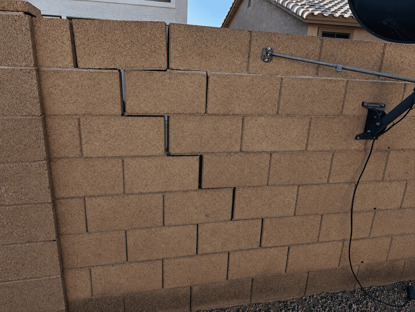 Gaps where the wall has separated — block wall damage example