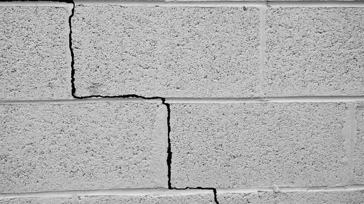 Stair-step crack patterns — block wall damage example
