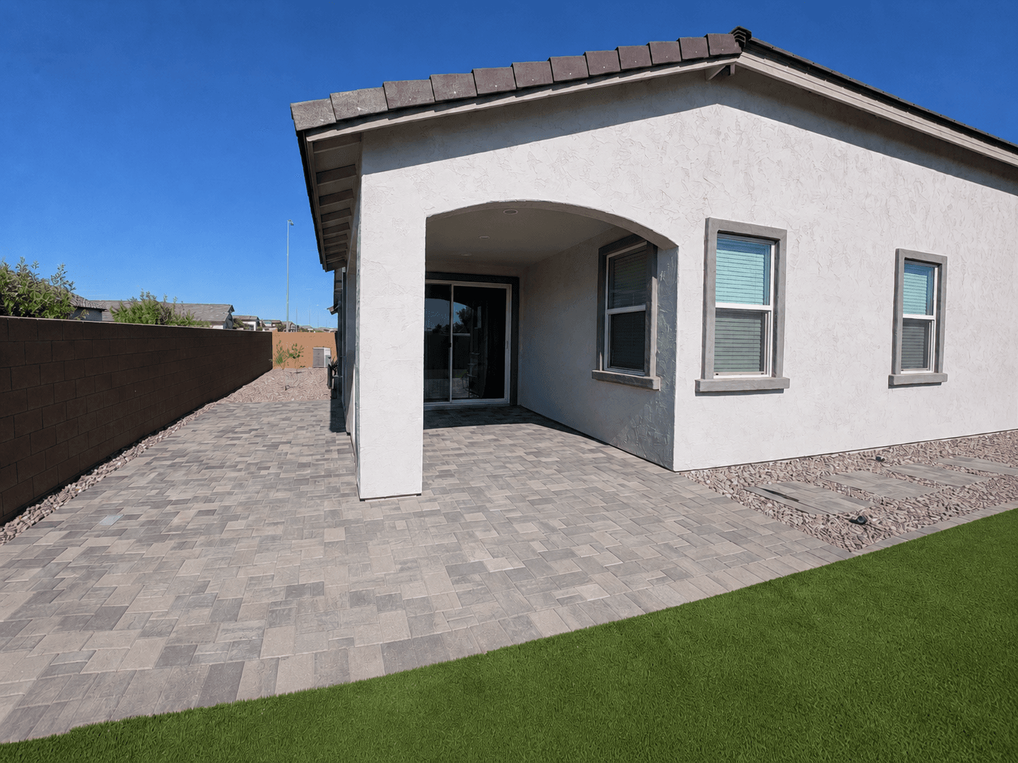 Paver patio installation in a backyard — Phoenix, AZ